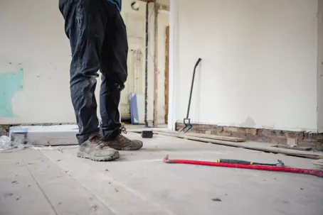 worker preparing for floor removal